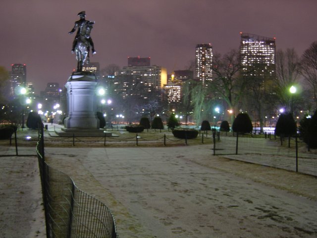 Boston Common, with a statue, guarding snow.